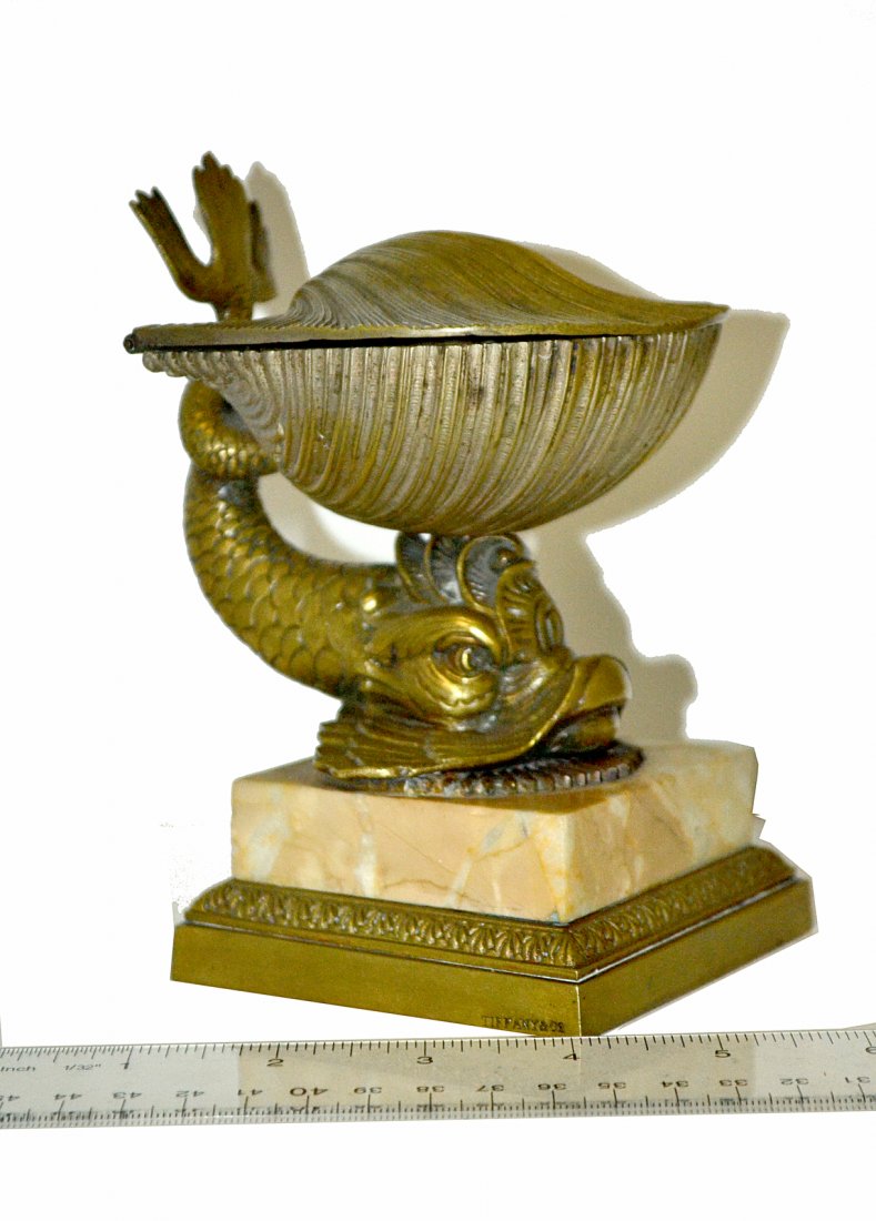 Vintage Tiffany & Co. Bronze Dolphin and Shell Box: Neoclassical style dolphin on a marble base with large hinged shell-form box on its head. [Overall: 4"W x 4 3/4"D x 6"H] Stamped "Tiffany & Co." on base. Shell loose, otherwise in good condition.