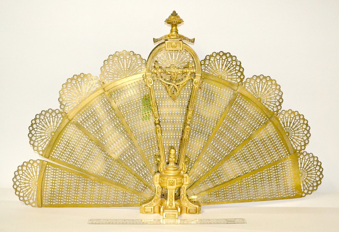 French Fireplace Screen: A fan-form reticulated fireplace screen (one panel loose and lockets bent), gilt bronze. [24 1/2"H]