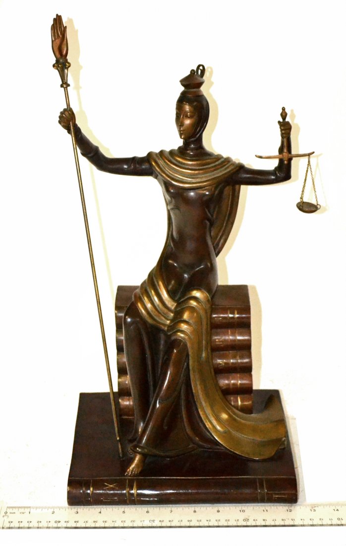 After Erte, Bronze- "Lady Justice": Stylized composition of Justice holding scale in left hand, staff in right, seated on a base of books. Inscribed "Erte" on base at left. Stamped with edition on back "114/500...Fine Art Acquisitions �