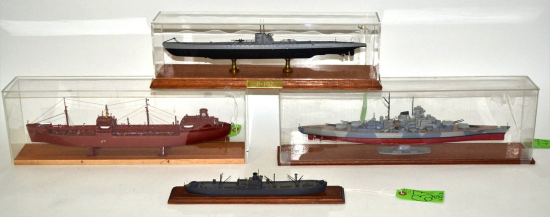 Four Mounted Plastic Ship Models: WWII & Comm.: Comprises: 1.) Cased model of the "Tirpitz." [Overall: 19" W x 3 3/8" D x 6" H] 2.) Cased German "U-107" by Iron Shipwright of Rochester, NY. [Overall: 16 3/4" W x 4 3/8" D x 5" H] 3.) Water-line mode