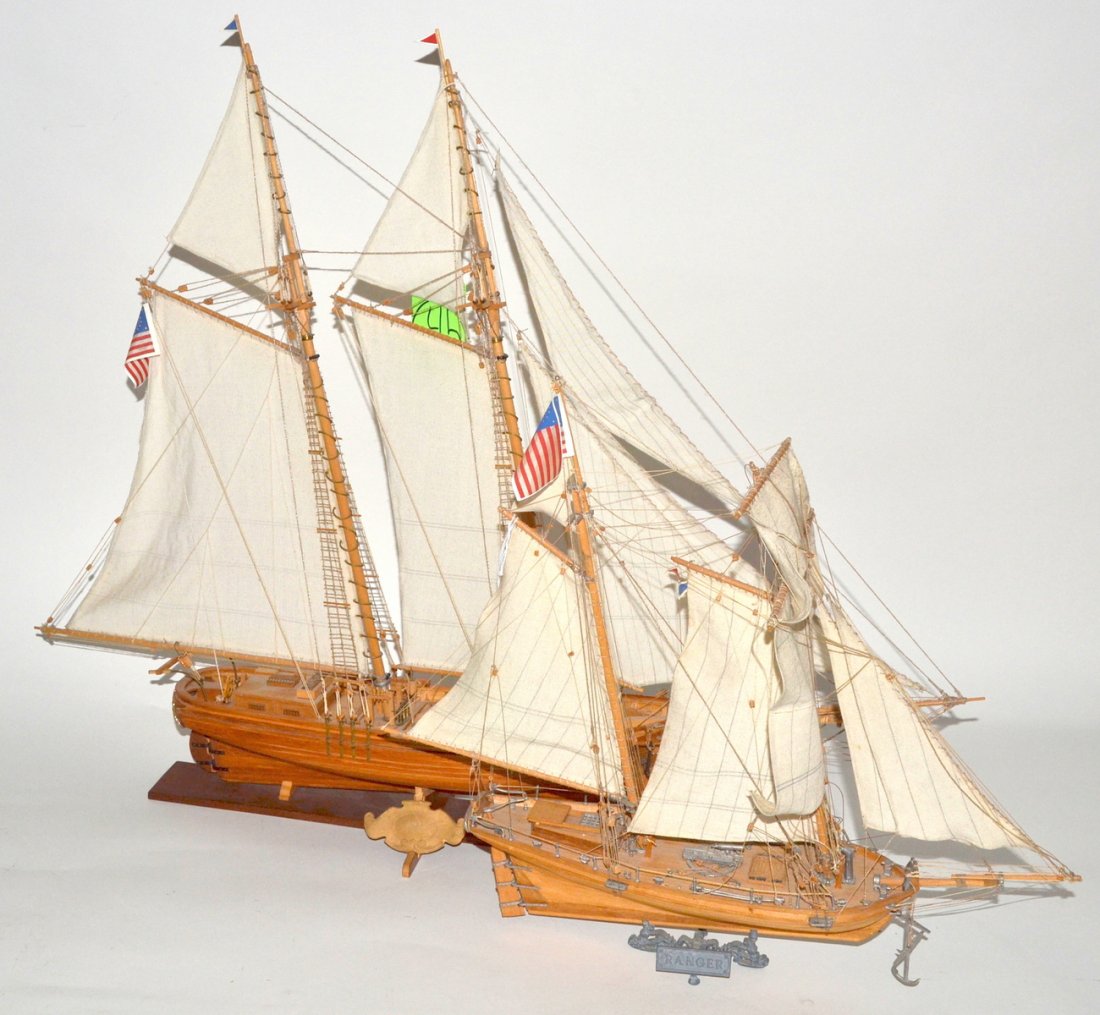 Two Scale 18th C. Style Sailing Ship Models: Both on mounts. Comprises: 1.) Wooden two-masted ship with full rigging, swivel deck cannon, and early 19th type U.S. flag. Minor defects. [15 1/4" L x 7 3/4" W x 15 1/2" H] 2.) Wooden two-masted ship
