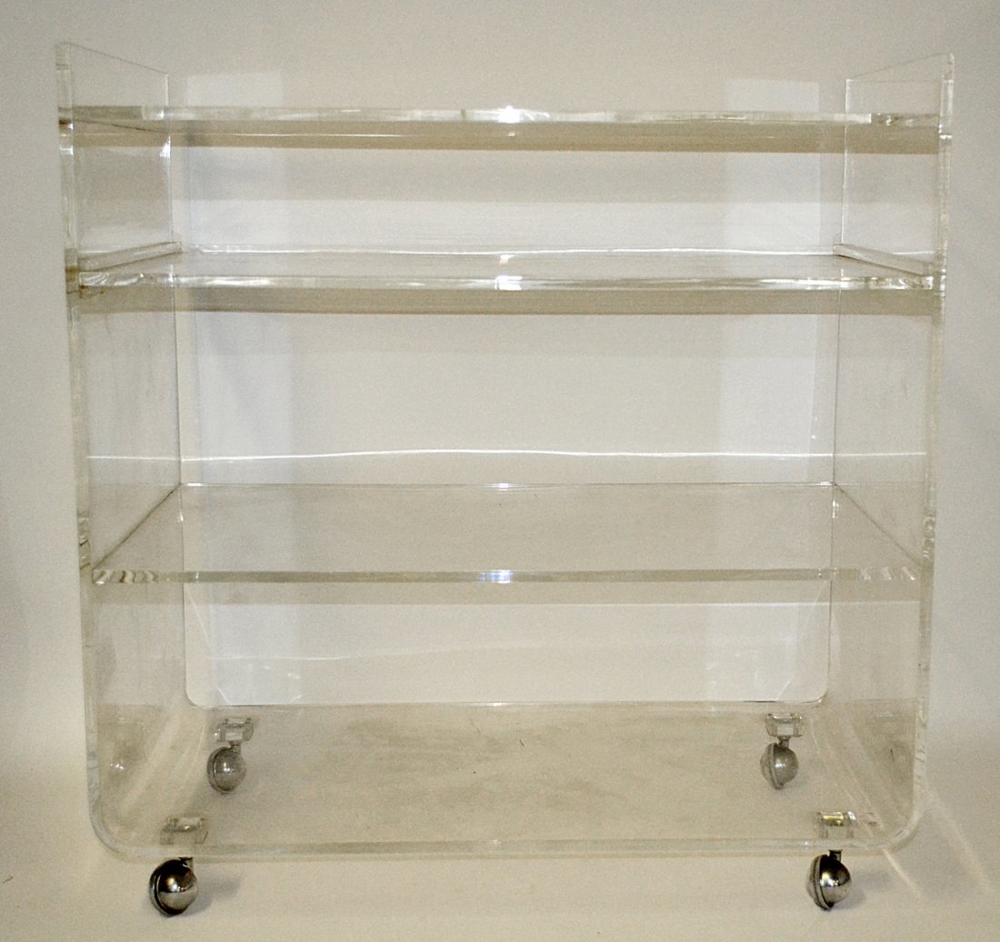 Modern Clear Acrylic Stand: Features four shelves [one removable] and chrome castor feet. [30"W x 16 1/2"D x 31 1/2"H] Some scuffs and scratches.