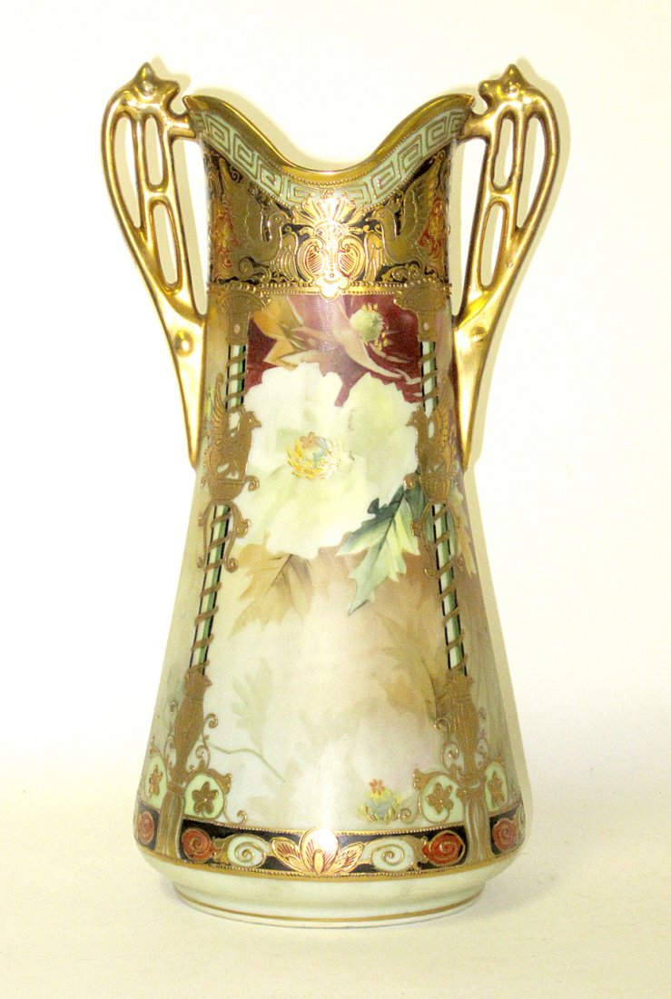 Nippon Porcelain Art Nouveau Vase: Hand-painted and gilt enamel vase with floral decor and pierced handles. [6 1/2"Dia. x 13 1/4"H] Both handles expertly repaired.