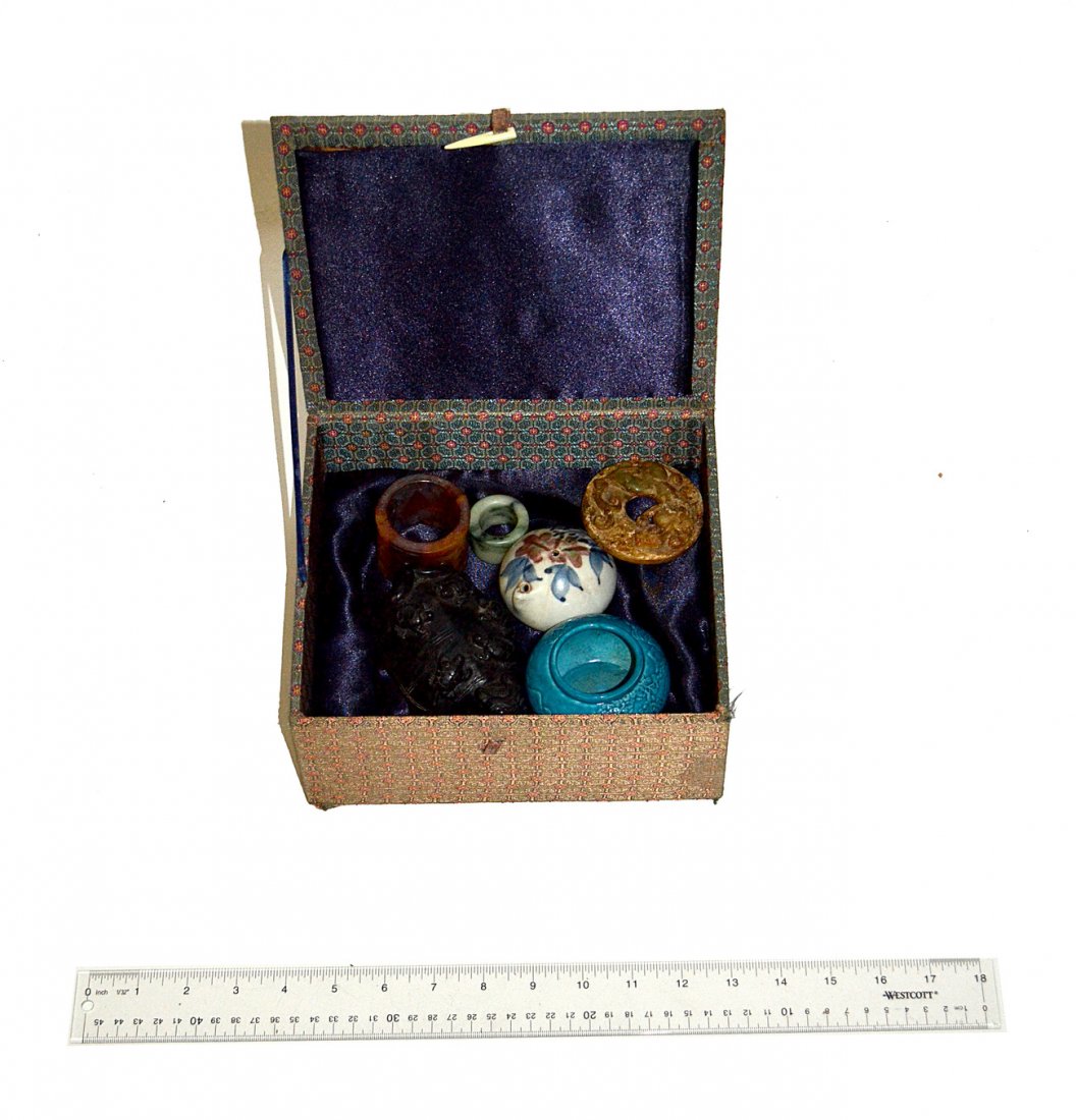 Six Assorted Asian Hardstone and Ceramic Articles: Comprises: 1.) Black stone "Foo" turtle. [3"W x 4 3/4"D x 1 7/8"H] 2.) Jade ring. [1 1/2"Dia. x 1"H] 3.) Hardstone ring [2 1/8"Dia. x 1 3/4"H] 4.) Jade medallion with panther motif. [2 3/4"Dia. x 3/8"