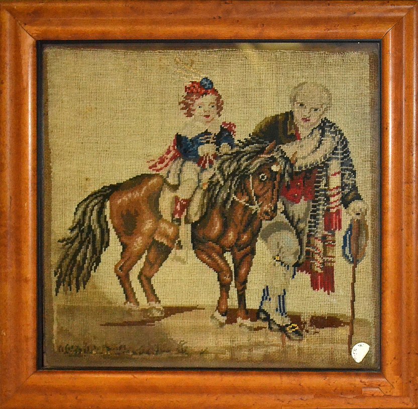 Framed Sampler- Figure and a Donkey: Depicts a man walking alongside a woman on a donkey. [Overall: 15" x 15 1/2"]