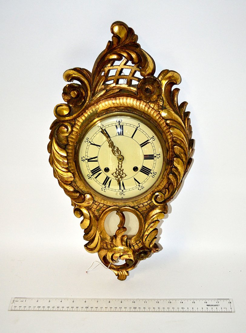 Gilt Wood Cartel Clock: Ornate gilt wood cartel clock, German works. Incised: "Fred D. Koch." [22" H]
