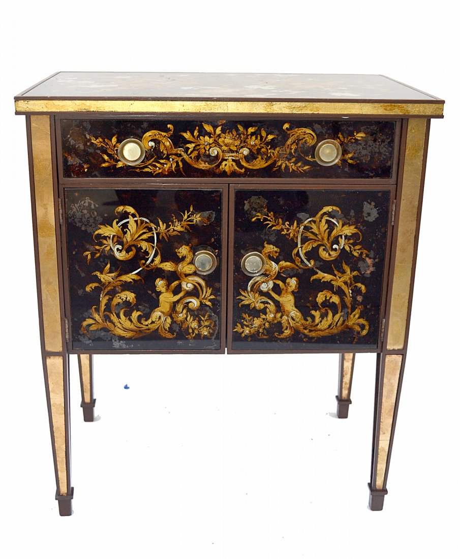 Italian Mid-Century Verre Eglomise Cabinet: Side table with one drawer above two doors. Features all-over reverse painted glass panels with Renaissance style ornament and reverse gilt trim. [24 1/4"W x15 1/2"D x 28 1/4"H]