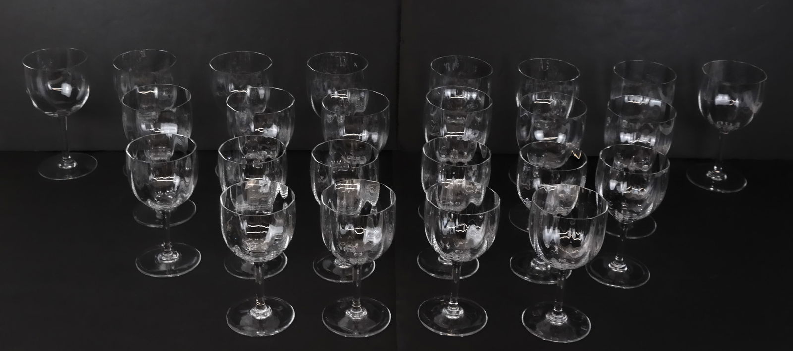 Baccarat "Montaigne Optic" Crystal Stemware: Baccarat "Montaigne Optic" pattern crystal stemware, comprising 10 white wine glasses [6.5" H x 3.25" Diameter], and 14 red wine glasses [7.25" H x 3.5" Diameter], marks to bases. Overall condition is