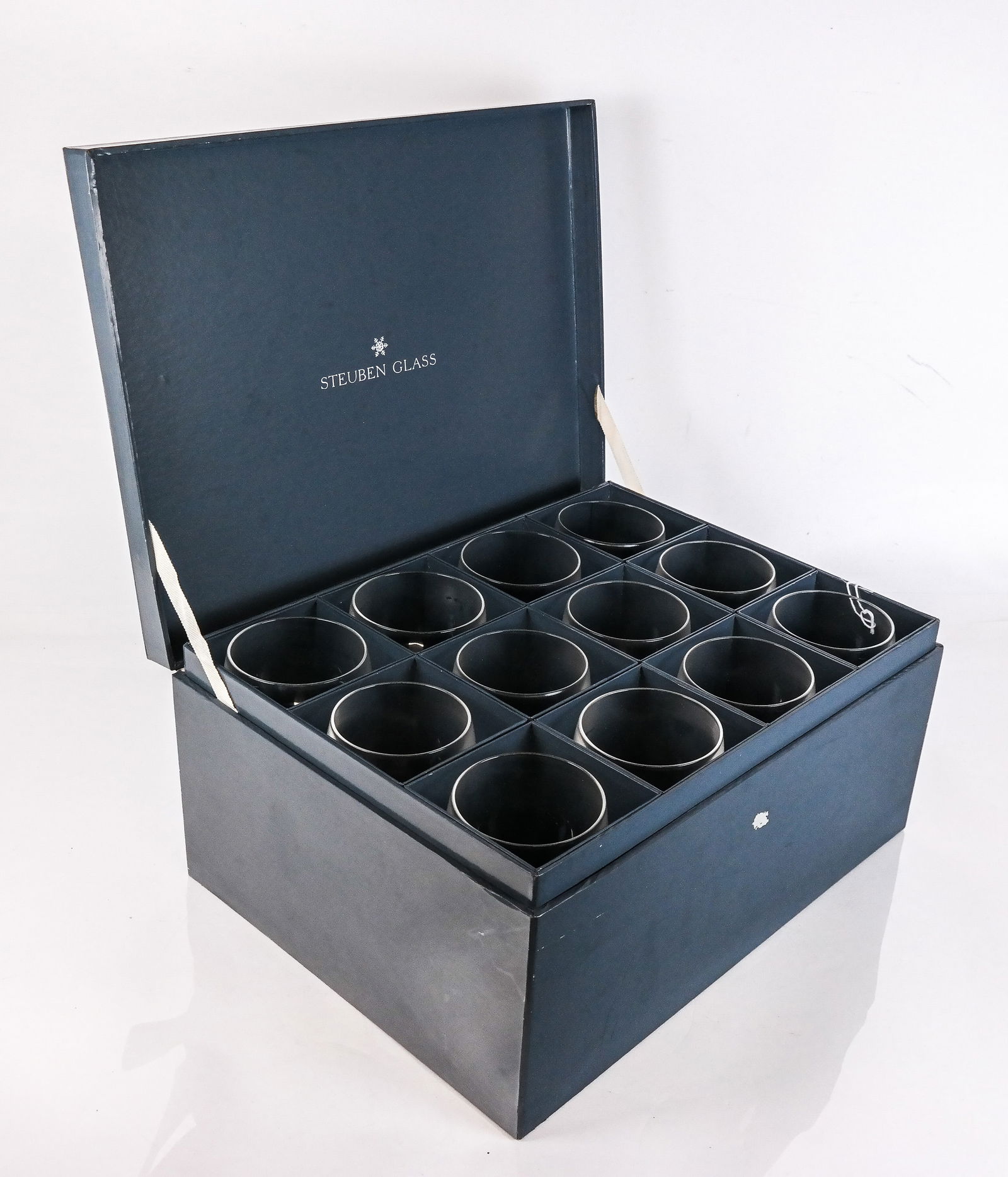 Steuben Crystal Cordials, 12: 12 Steuben crystal cordials in original box, all marked at bases [4.5" H x 2.5" Diameter]. Condition is good.