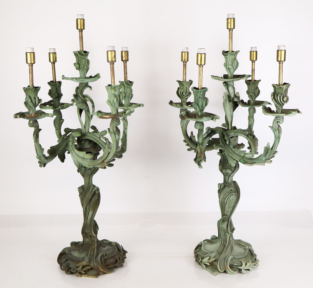 Pair of Louis XV Bronze Candelabra: Pair of Louis XV bronze candelabra, 19th century, with five lights and floral decoration, later electrified. [24" H x 14" Diameter]. Condition is fair with significant patina to bronze; wires cut.