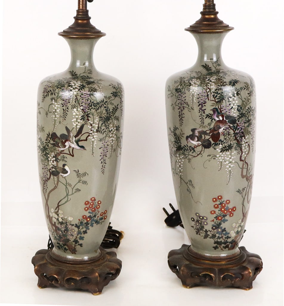 Pair of Japanese Cloisonne Vases Mounted as Lamps: Pair of Japanese cloisonne vases, 19th century, mounted as lamps with bronze mounts to lower, two lights, and Buddha finials. [26.5" H x 6" Diameter]. Condition is good with some minor losses and hair