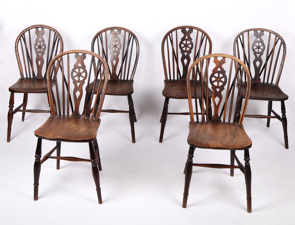 Six Handmade Walnut Windsor Chairs: Six handmade walnut Windsor chairs, 19th century, with a decorated seat rest with supports to reverse, tuned legs and a cross stretcher at lower, and joinery, all slightly varied in size. [Largest: 35