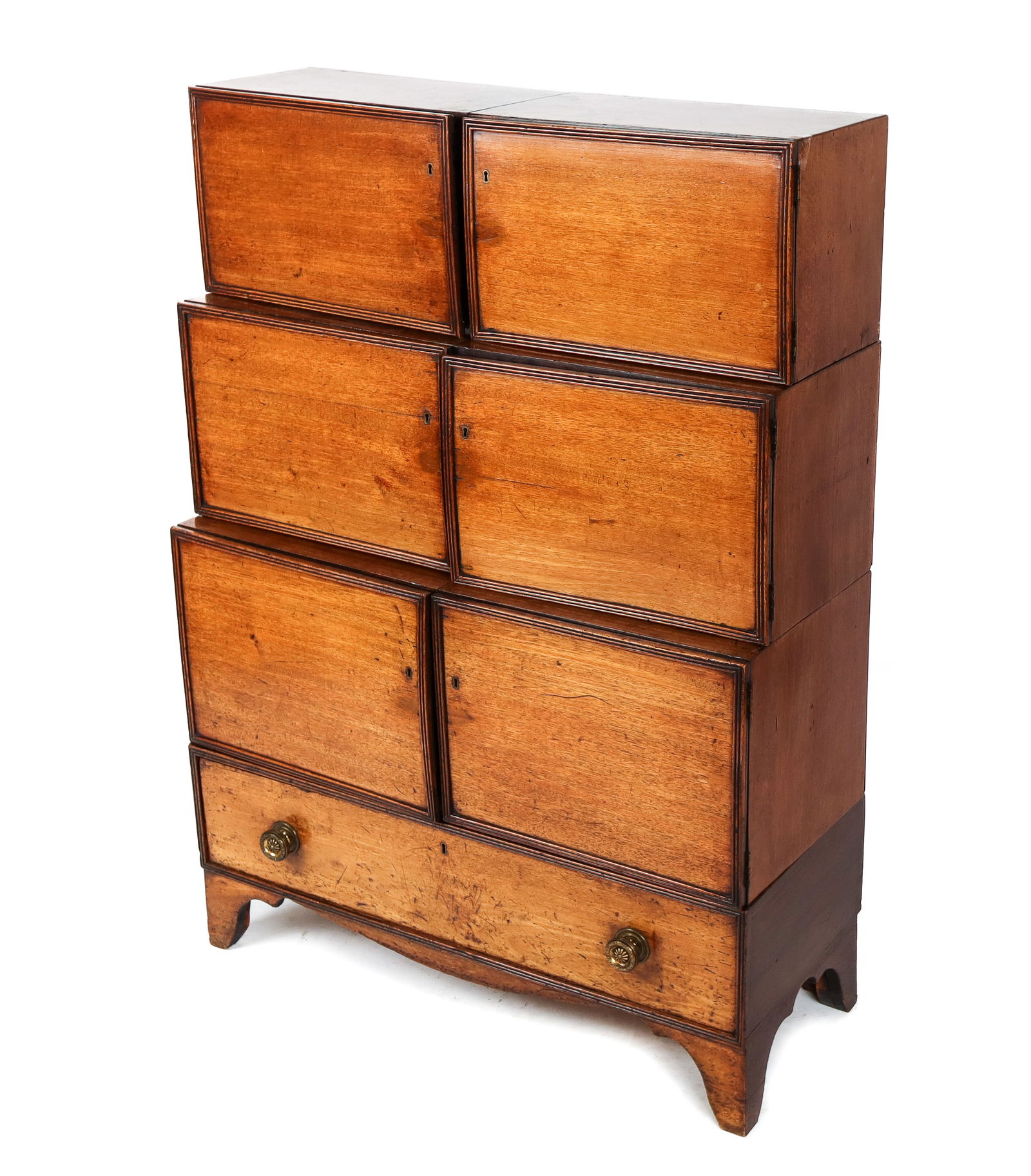 Stepped Walnut Cabinet: Stepped walnut modular cabinet, 20th century, with three double compartments to upper, over a long brass mounted drawer, on feet. [51" H x 36" W x 15" D]. Condition is good with some wear to wood and
