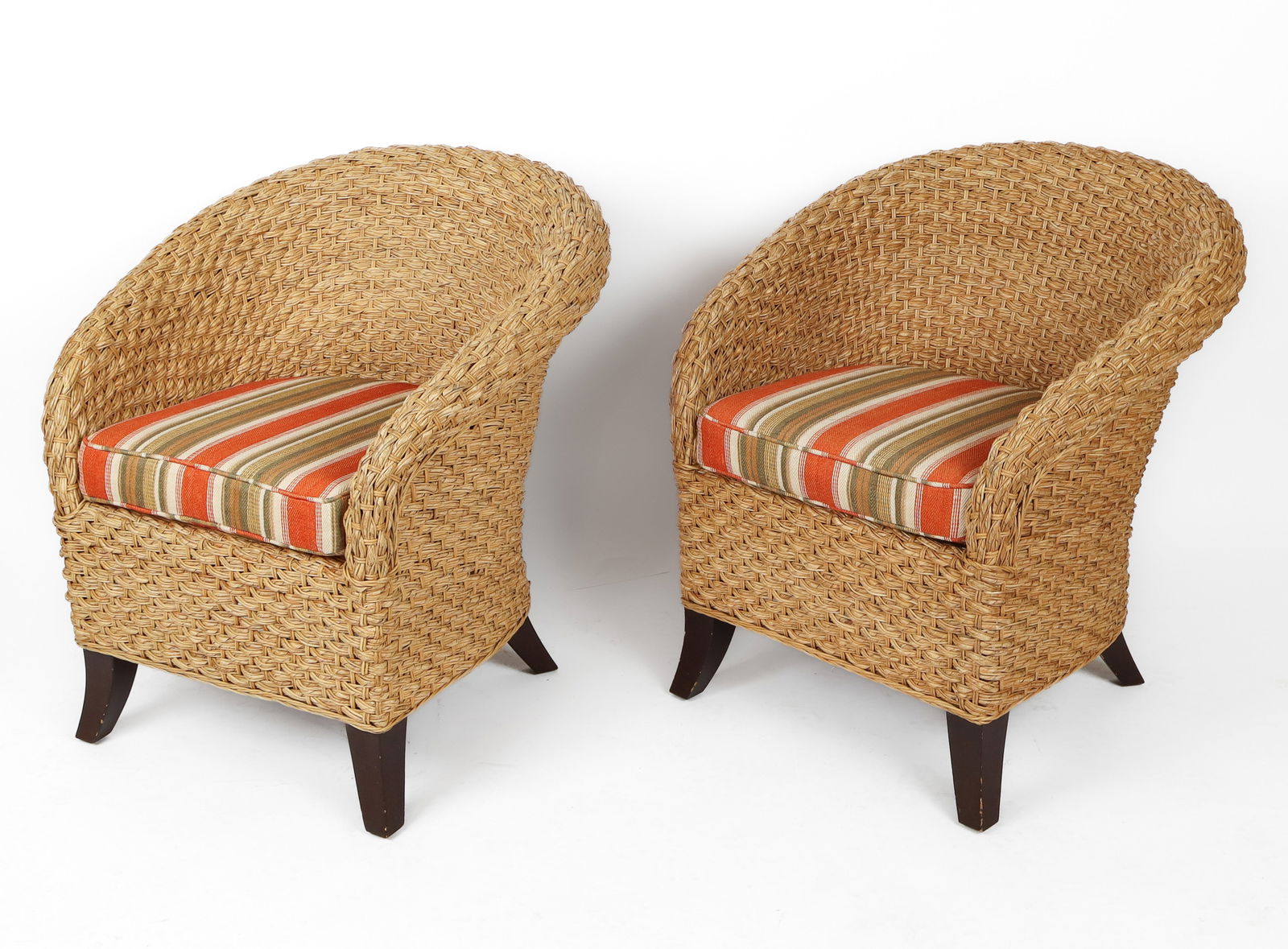Pair Of Modern Wicker & Bamboo Chairs: Pair of modern barrel-back chairs with multi-striped cushions. [32" H x 25.5" W x 28" D; 19" H to seat].