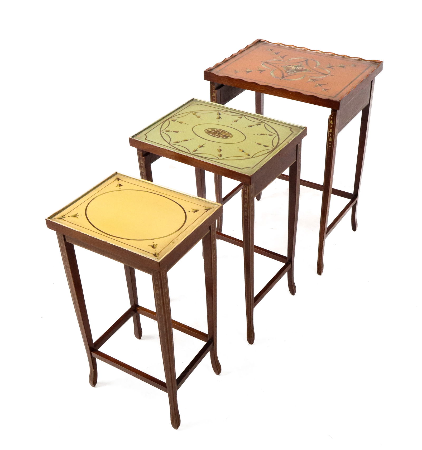Hand-Painted Nesting Tables, 3: Three hand-painted nesting tables, 20th century, with decorated tops under glass, and legs and aprons decorated with floral motifs. [Largest: 20" H x 14.25" W x 11" D]. Condition is good.