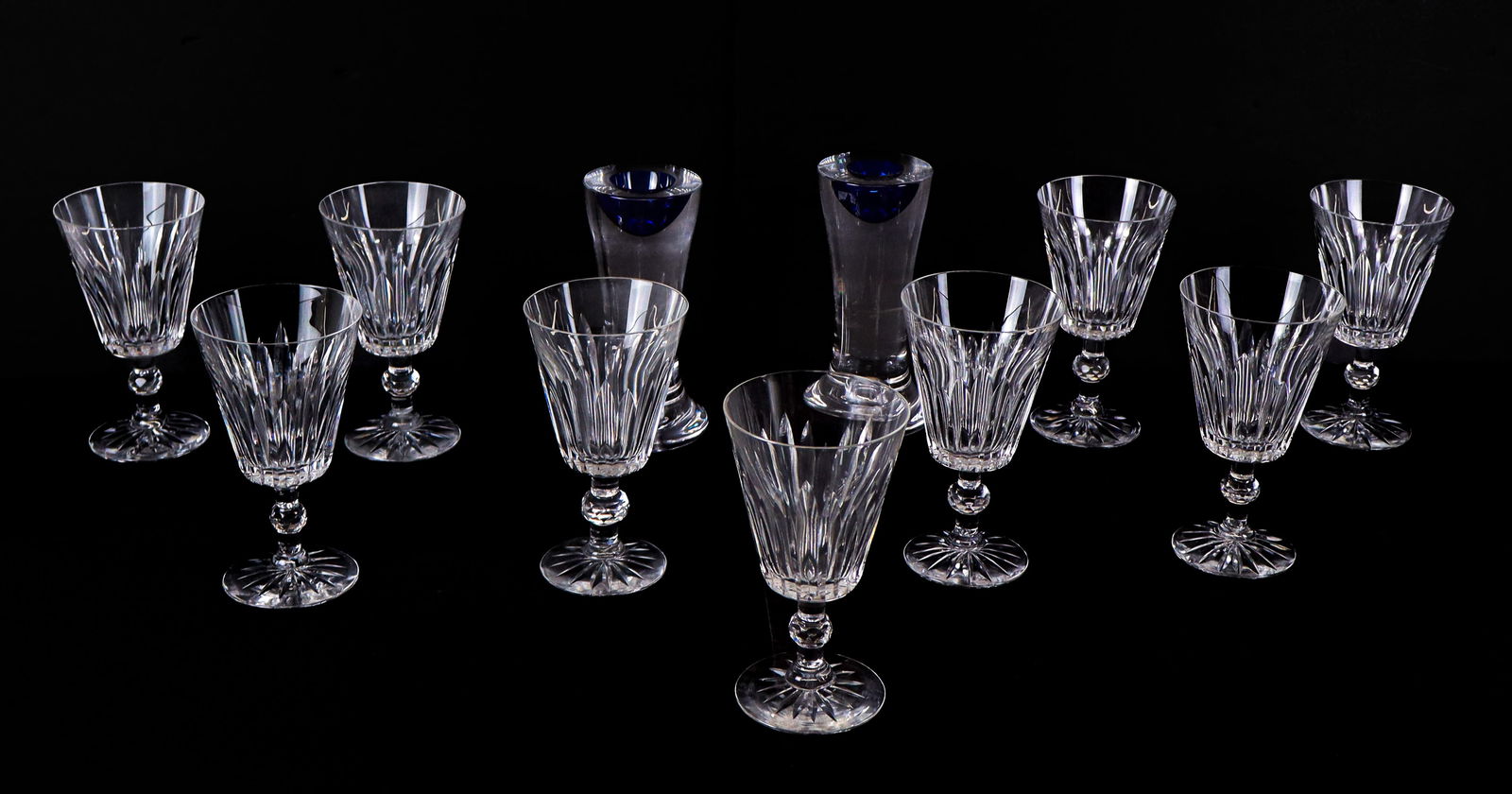 Kosta Boda Glass Stemware & Candlesticks, 11: Collection of Kosta Boda glass comprising a pair of cobalt blue and colorless "Zoom" candlesticks designed by G?ran W?rff, signed and numbered to base [6.5" H x 3.25" Diameter], and 9 "Pyramid" patter
