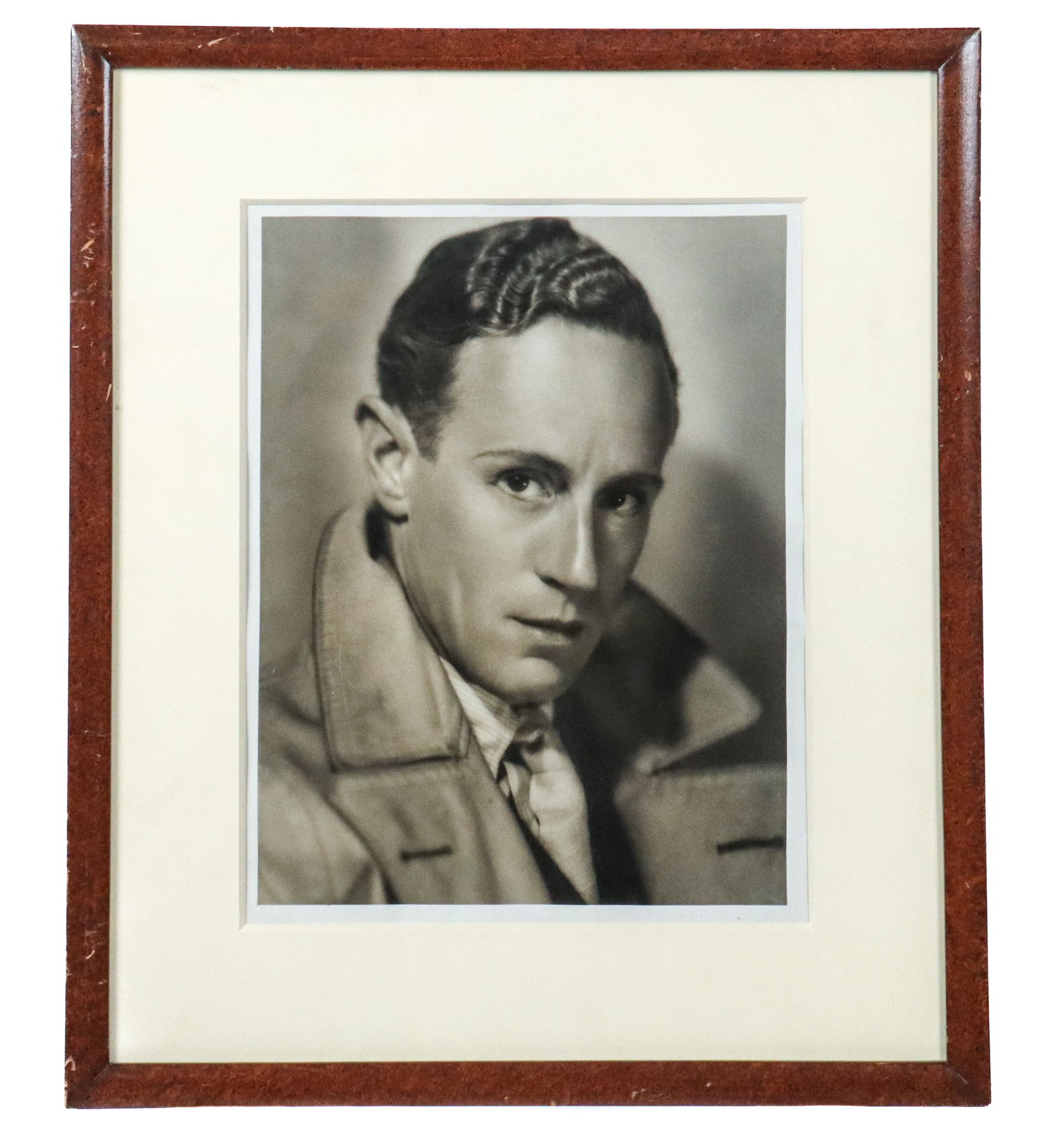 George HURRELL: Portrait of Leslie Howard - Photo: George Edward Hurrell (American, 1904-1992) matted and framed gelatin print depicting a portrait of English actor and director, Leslie Howard, 1930s. With impressed signature to margin lower right "HU