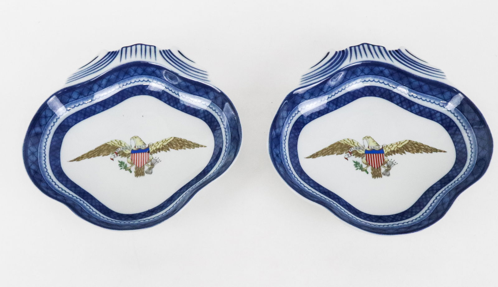 Mottahedeh Pair of Chinese Export Inspired Diploma: Mottaheeh pair of Chinese Export inspired diplomatic plates, marks to base. [2" H x 8.25" W x 8.5" D]. Overall condition is good. Estate of Priscilla and Byam K Stevens Jr.