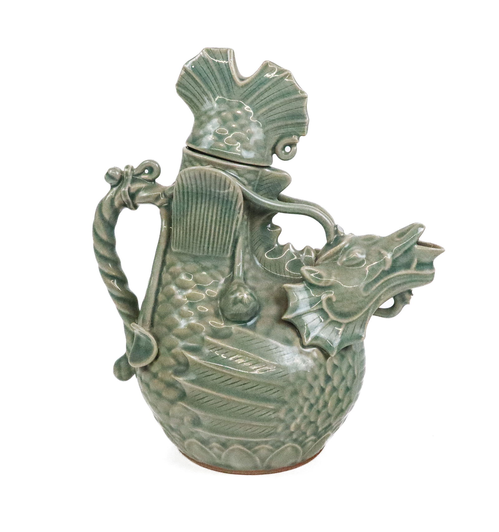 Chinese Celadon Teapot: Chinese celadon teapot, 20th century, with fish decoration, and marked to base. [10" H x 8.25" W x 5" D]. Condition is good with a break above spout and to decoration at one side.