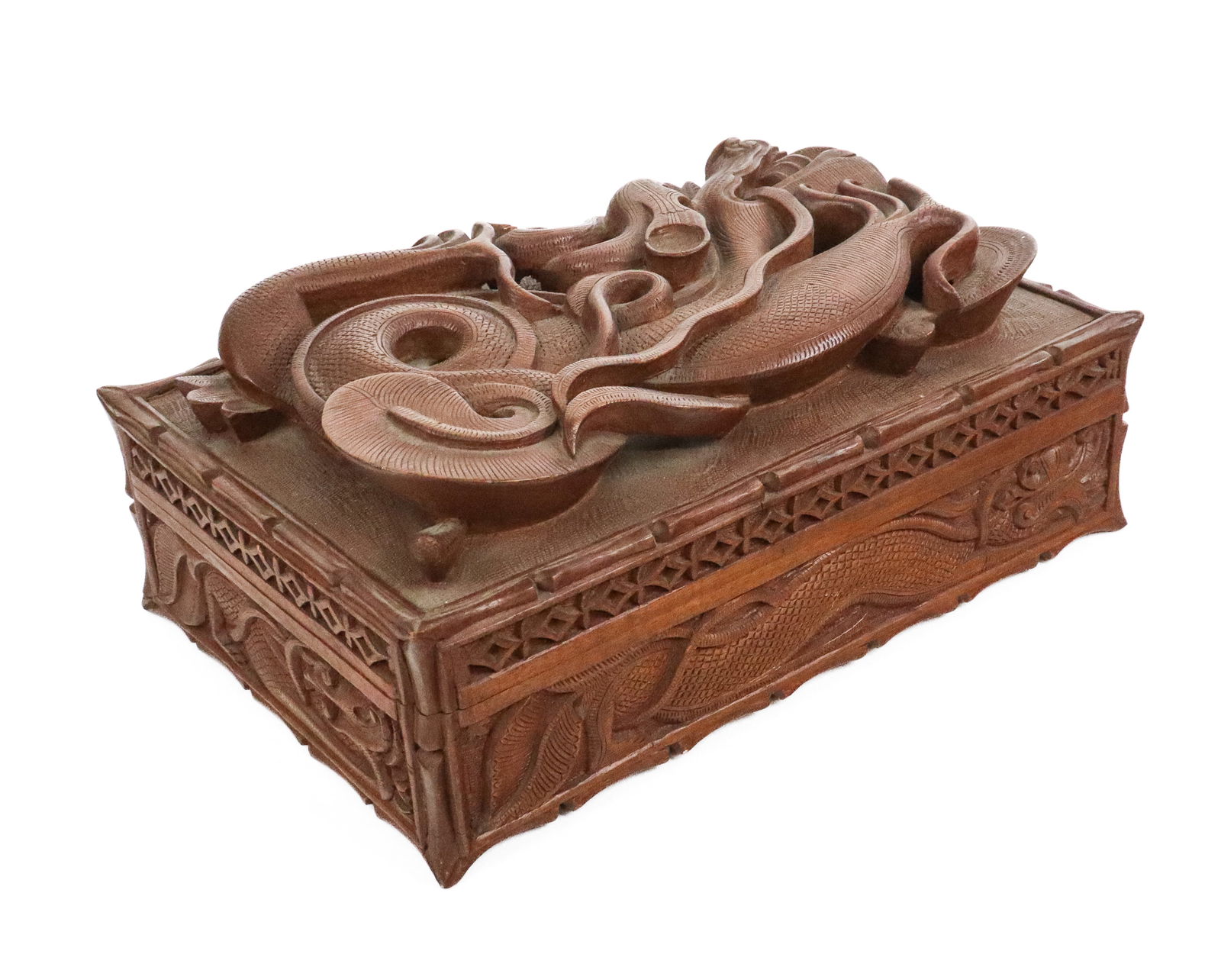 Carved Wood Box with Dragon: Carved wood box, 20th century, with a hand-carved dragon to lid, bamboo border, and decoration to lower, with two compartments to interior. [4.5" H x 8.5" W x 6" D]. Condition is good with two minor l