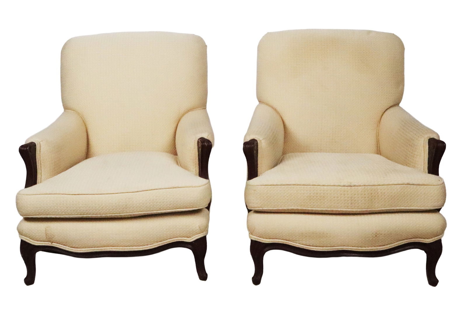 Pair Louis XV Upholstered Bergeres: Pair Louis XV upholstered bergeres, 20th century, with carved frames and cabriole legs. [36" H x 27" W x 32" D; seat height: 15.5"]. Condition is good to fair with wear to upholstery and frame.