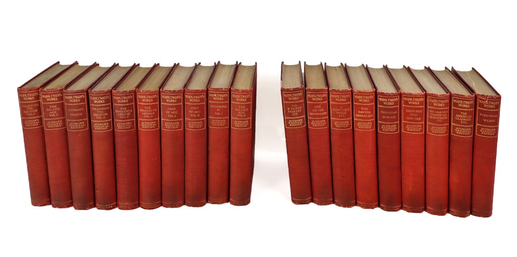 Mark Twain's Works, Author's National Edition, 19: Collection of Mark Twain's Works, 19 volumes, red leather and cloth. [7.5" H x 5.5" W x 1.5" D]. Overall condition varies, age commensurate with age, some minor pencil marks.