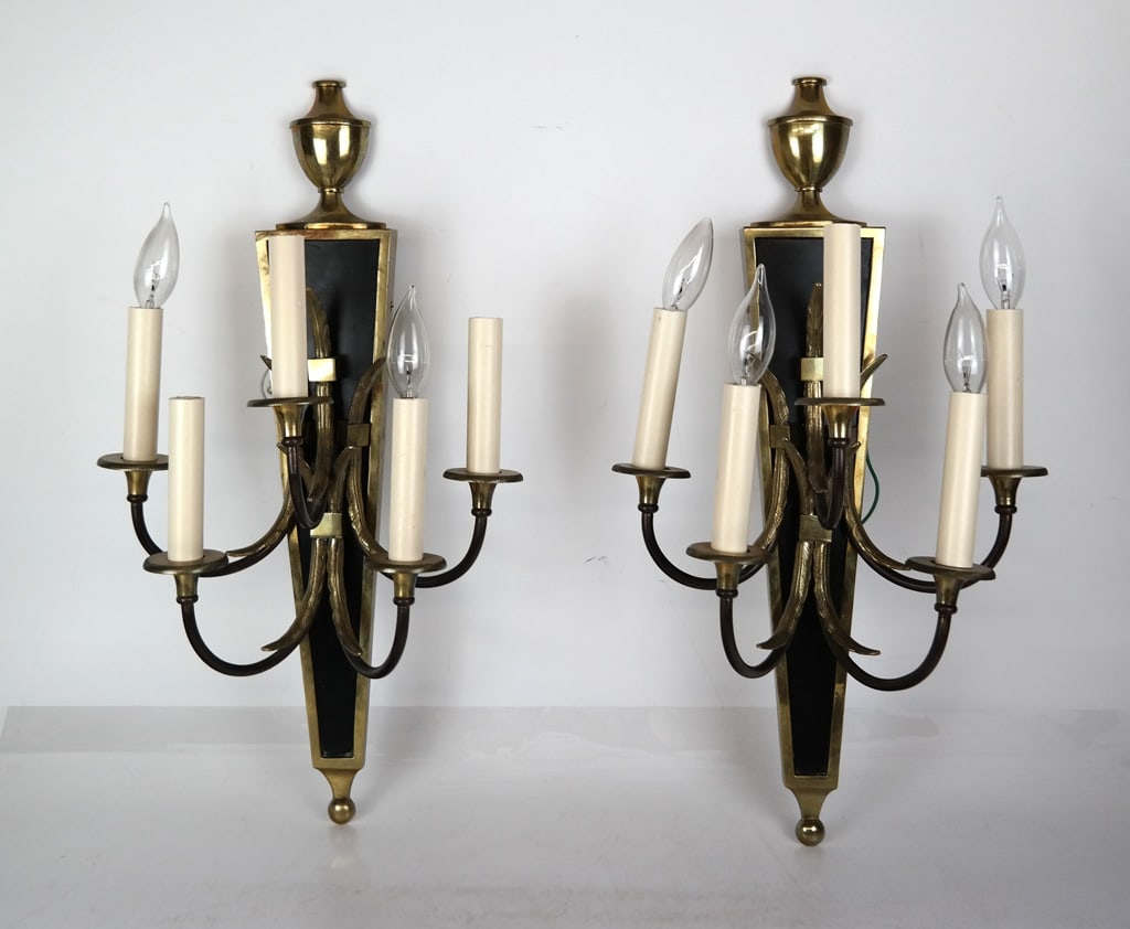 Pair of Neoclassical Gilt Bronze Wall Sconce: Pair of Neoclassical gilt and black painted bronze five light wall sconces, accented with demi-urn form finials and feather scrolls. [23.5 " H x 12.5" W x 7.25" D]. Overall condition is good, some