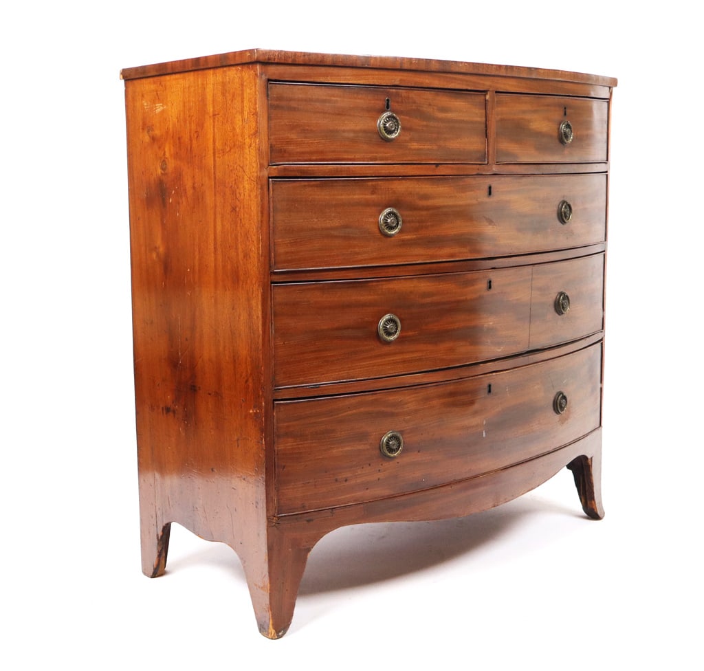 George III Mahogany Bow Front Chest: George III mahogany bow front chest of drawers, late 19th, with two short drawers above three long drawers. [41.5" H x 42" W x 21" D]. Overall condition is fair, split to top and interior drawers,
