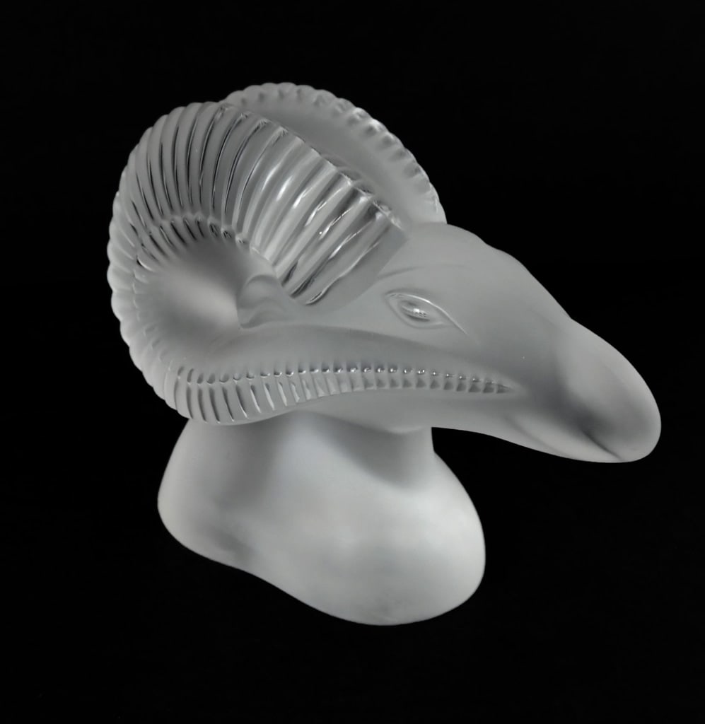 Lalique Crystal Amon Ram's Head Sculpture: Lalique Egyptian inspired crystal amon ram's head sculpture, signed "Lalique France". [6.5" H x 8" L x 3.5" W]. Overall condition is good, minor scratches to base.