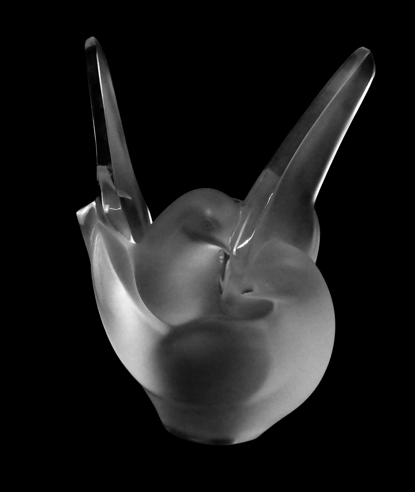 Lalique Crystal Sylvie Dove Vase with Flower Frog: Lalique crystal "Sylvie" dove vase with flower frog, signed on base "Lalique France" under paper label. [8.25" H x 7.5" W x 4" D]. Overall condition is good, minor scratches to base.