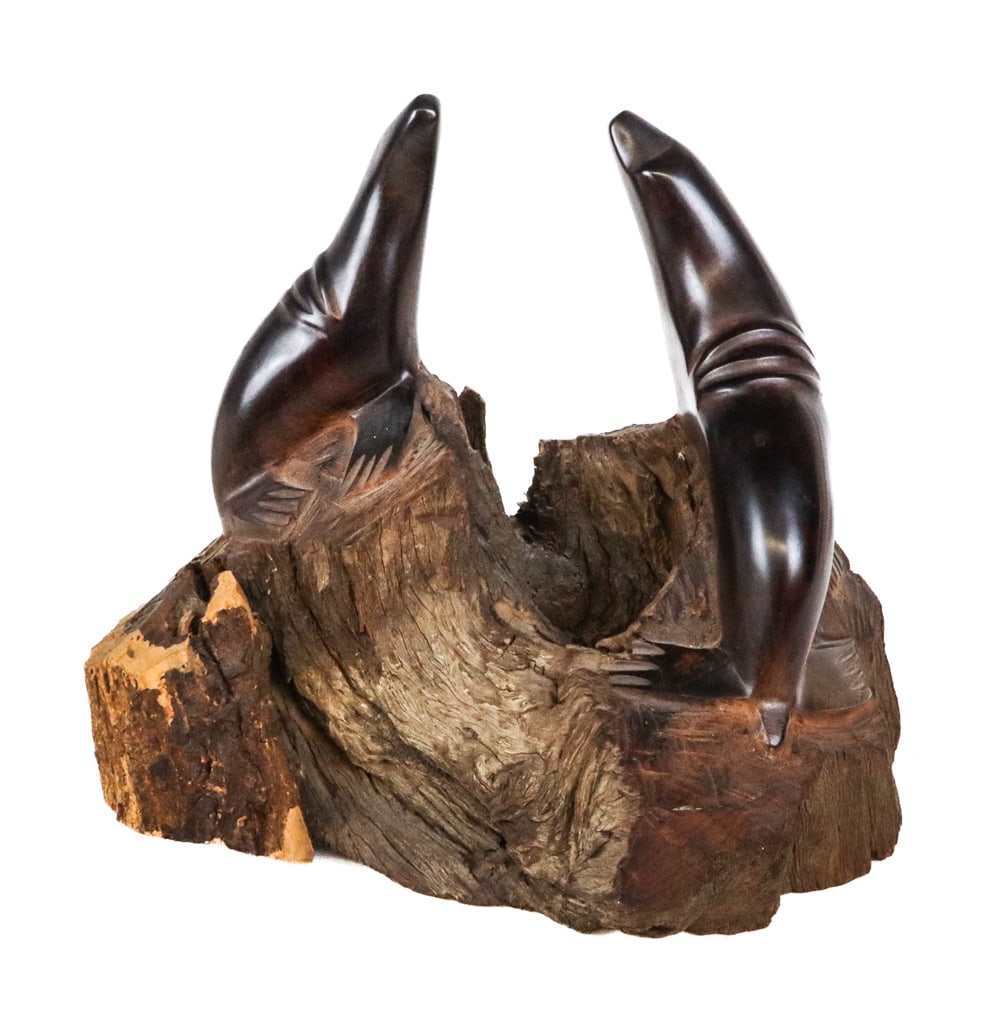 Mid-Century Modern Carved Wood Seal Sculpture: Mid-Century modern carved ironwood seal sculpture, Mexican mid-20th century, with a live edge lower and cork mounted base. [14.5" H x 15" W x 12" D]. Condition is good with some age-commensurate wear.