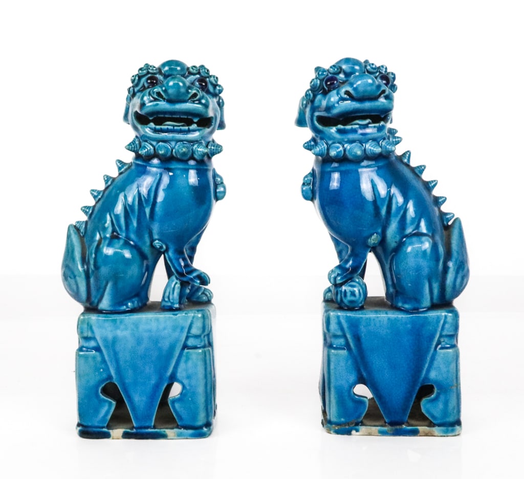 Chinese Pair of Turquoise Glazed Foo Dogs: Pair of Chinese turquoise glazed foo dogs, 20th century, marked China to bases. [10" H x 5" W x 3.75" D]. Condition is fair, one with significant repairs to base.