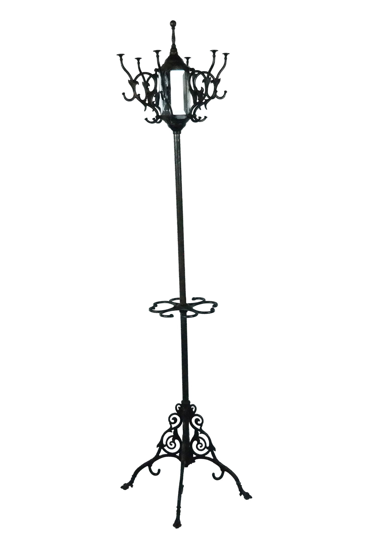 Victorian Metal and Mirror Hall tree: Victorian mirrored hall tree, 19th century, with six hooks to upper and beveled mirror detail, over an umbrella holder at lower, with curled legs on paw feet. [73" H x 21" W]. Condition is good. From