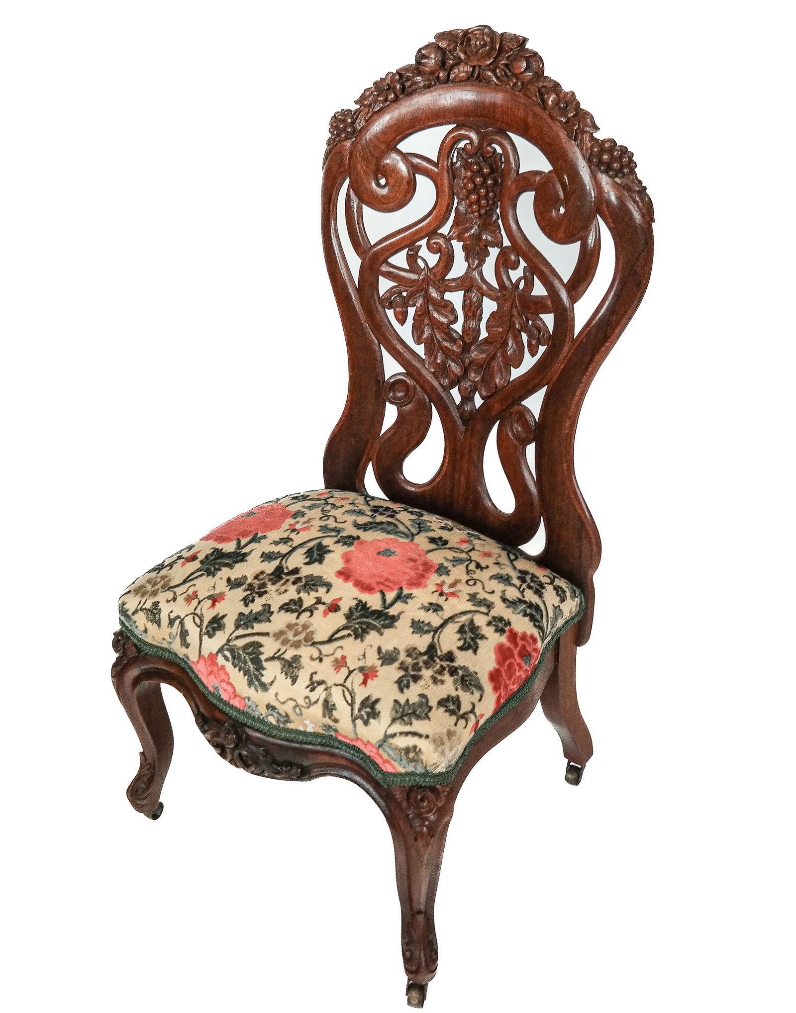 Belter Laminated Rosewood Slipper Chair: John Henry Belter Victorian laminated rosewood slipper chair, mid-19th century, with carved floral and grape cluster, and velvet upholstery, with legs mounted with castors, unsigned. [37" H x 18" W x