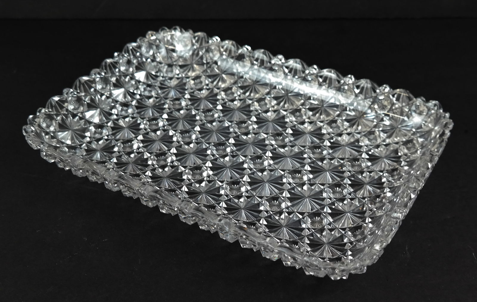 American Brilliant Period Cut Glass Serving Pieces: American Brilliant Period cut glass serving pieces with star and rosette patterns, comprising rectangular tray, three plates and three bowls, unmarked. [Tray: 1.75" H x 111.25" L x 7.75" W; Plates: