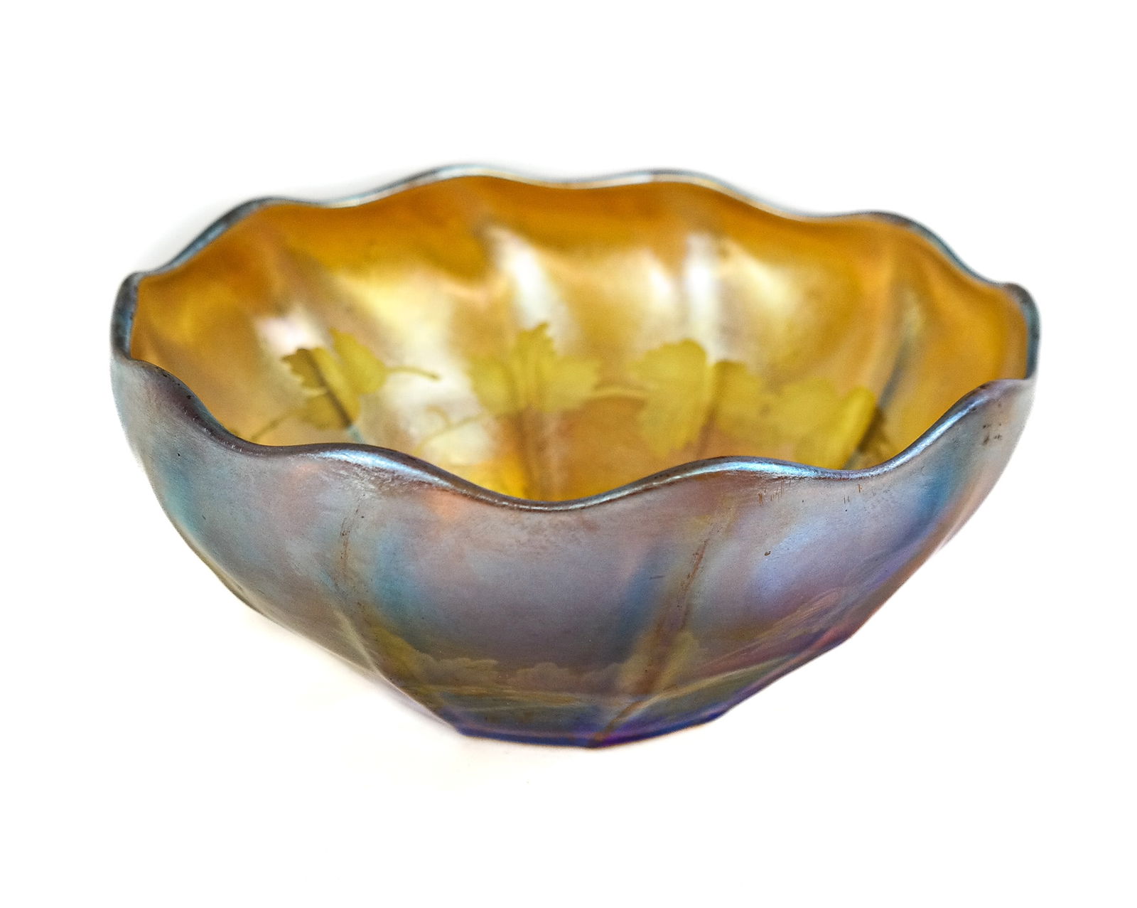 Louis Comfort Tiffany Favrile Bowl: Louis Comfort Tiffany unusual favrile bowl acid etched grape leaf interior, in gold tones with orange near rim and green highlights near base, mark to base "L.C. Tiffany - Favrile". [2.75" H x 6.25"