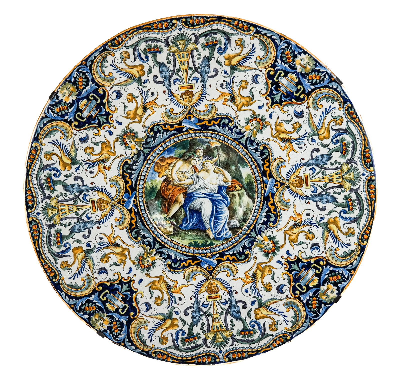Antique Palatial Majolica Charger: Antique palatial majolica polychrome decorated charger, probably Italian, late 19th century, the wide border decorated with griffins, masks, burning urns and scrolls, all centering a Renaissance inspi