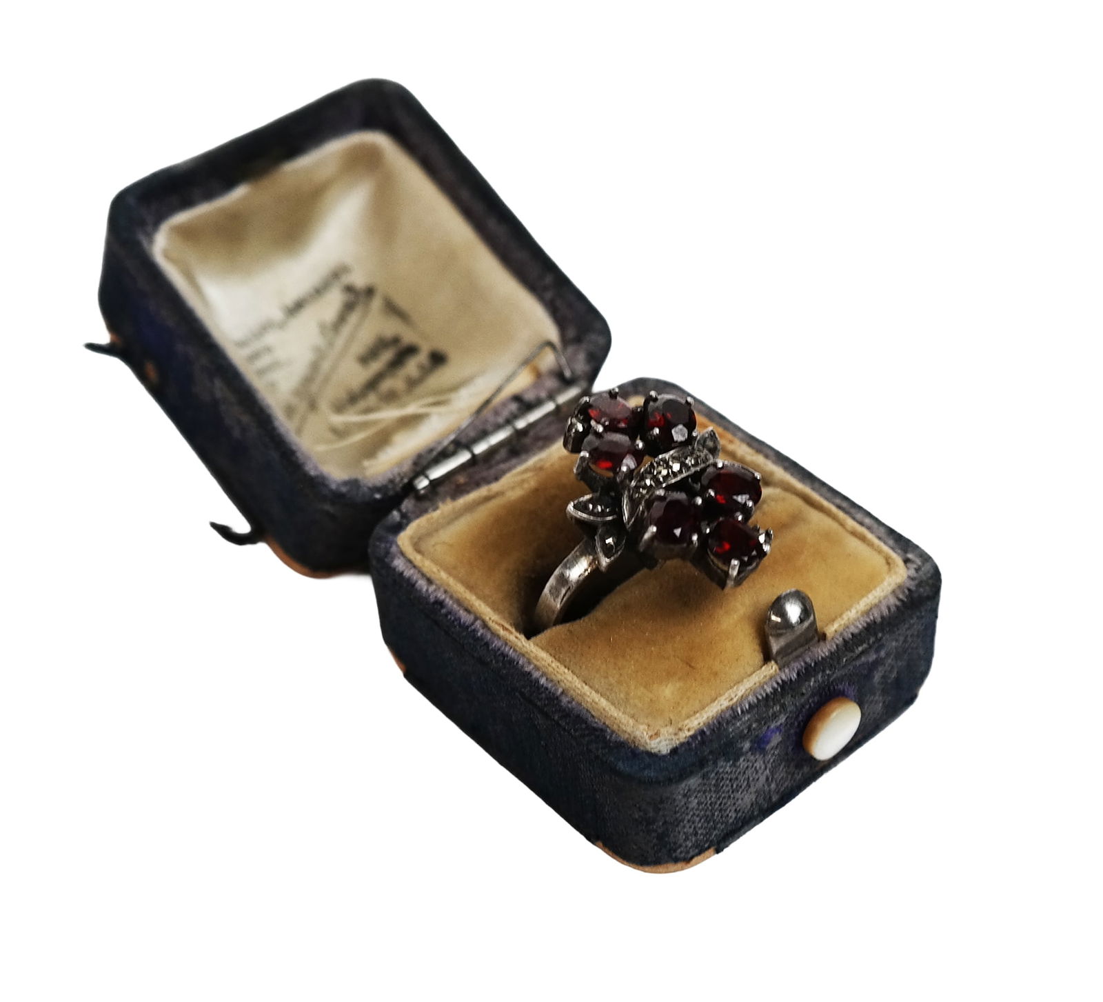 Antique Garnet and Marcasite Ring: Antique garnet and marcasite foliate cluster ring mounted in sterling silver, mark to shank "925", set with six oval faceted garnets. [Ring size: 7.75]. Overall condition is good, wear commensurate