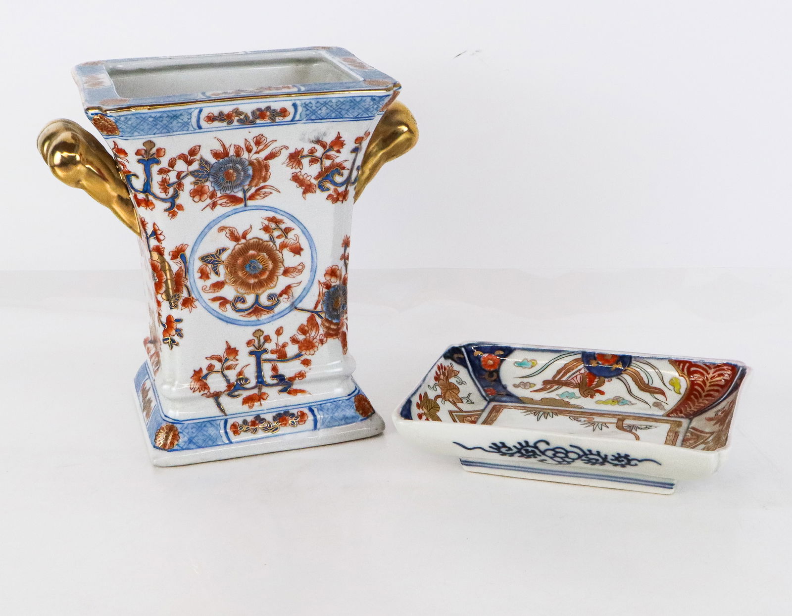 Two Imari Porcelain Articles: Two Imari porcelain articles, 20th century, comprising a Chinese Imari two handled vase or cache pot with hand-painted and gilt decoration and an archaistic mark to base, accompanied by a Japanese