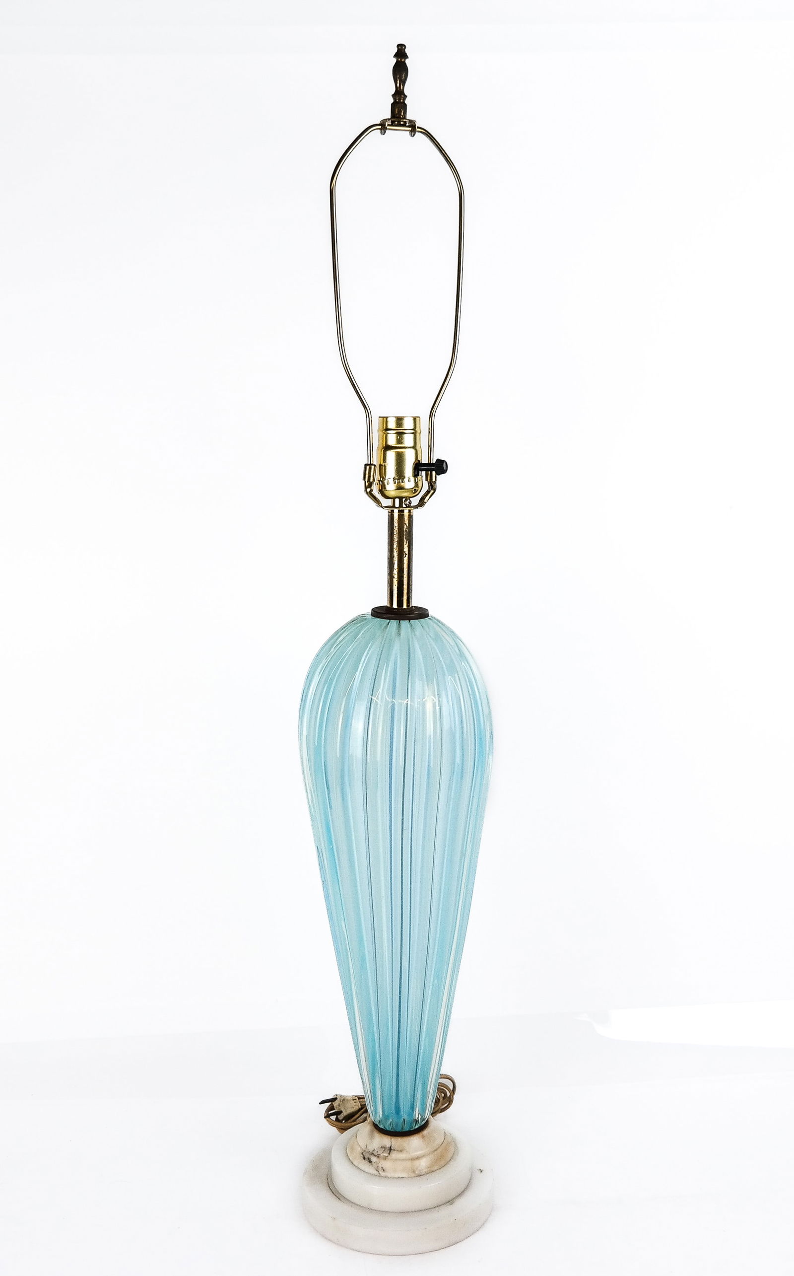 Mid-Century Modern Powder Blue Glass Lamp: Mid-century modern double layered fluted balloon form glass lamp, with stepped white marble circular base, probably Murano, unsigned. [ 24" H to top of socket x 6" Diameter]. Overall condition is good