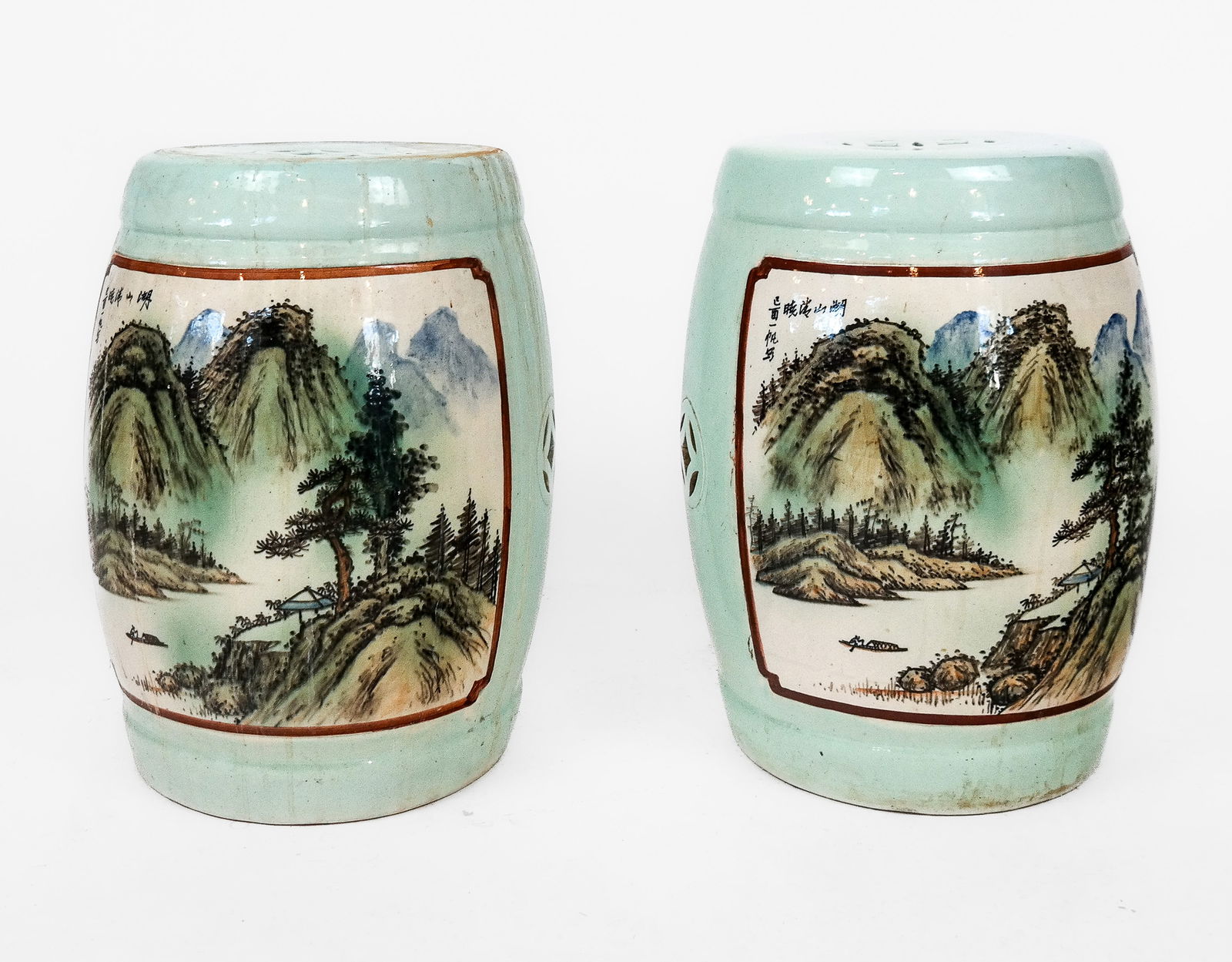 Chinese Pair of Celadon Garden Seats: Pair of Chinese porcelain garden seats, 20th century, with celadon glaze and landscape cartouches with hand-decoration and inscribed. [18.25" H x 14" Diameter]. Condition is good with surface wear.