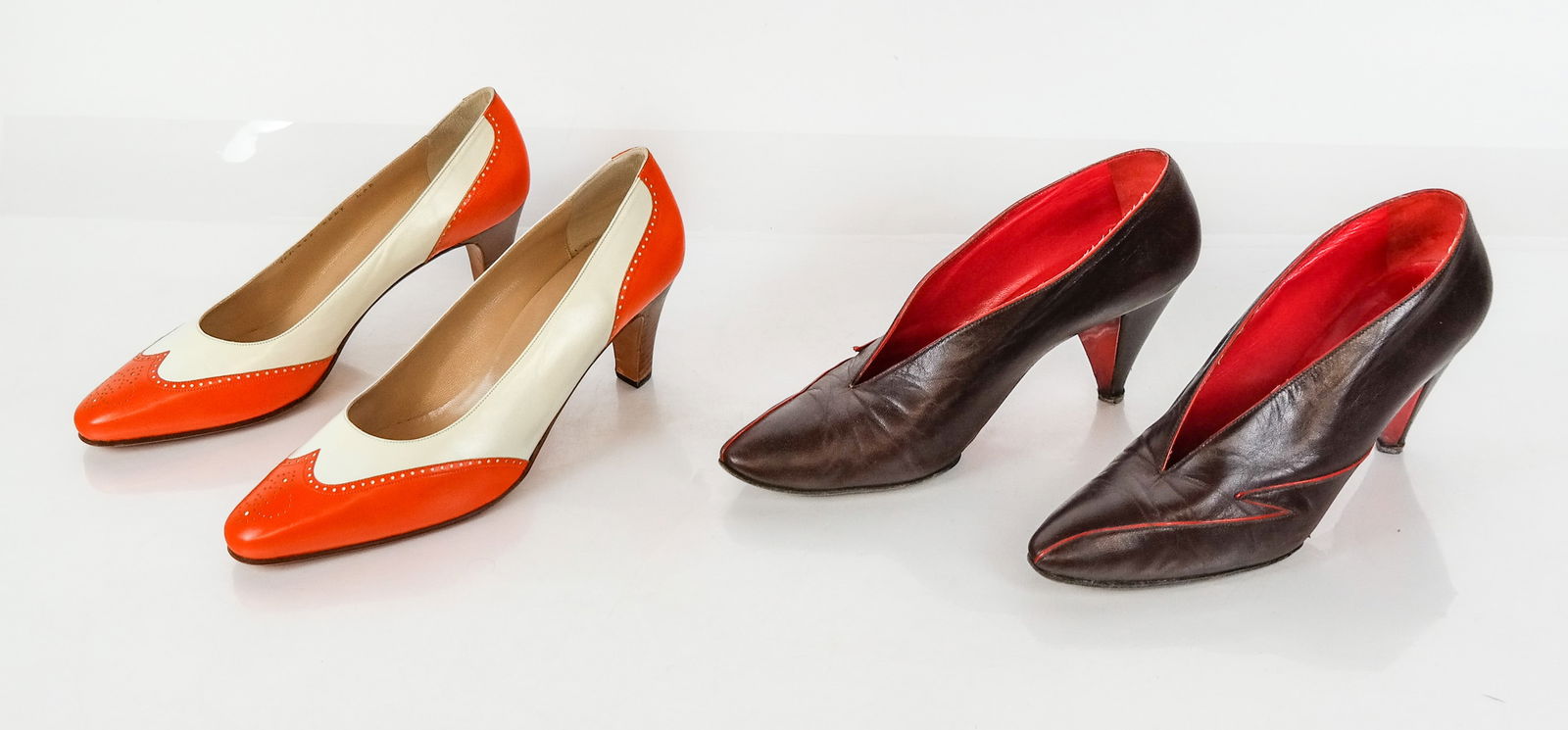 Gucci and Bottega Veneta Vintage Heels, Two Pairs: Two pair of vintage heels, second half of the 20th century, comprising a pair of brown and red leather heels from Bottega Veneta, and a pair of Gucci heels with pierced design, each with marks to inso