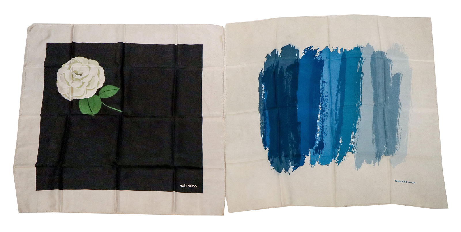Balenciaga and Valentino, Two Silk Scarves: Two silk scarves comprising a Valentino scarf with rose decoration, and a Balenciaga scarf with blue decoration, each marked. [Valentino scarf: 33" Square]. Condition is good with some minor wear. Fro