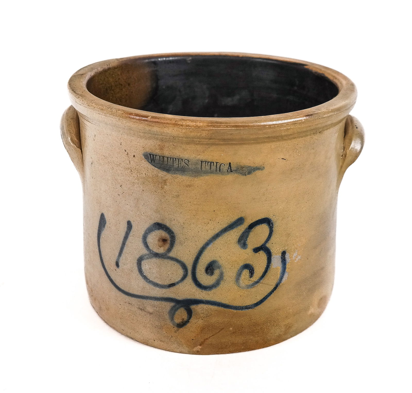 White's Utica Stoneware Crock: White's Utica stoneware bowl, American 1863, with blue tone number and White's Utica stamp to upper, and two handles. [7" H x 9.5" W x 8.5" D]. Condition is good with some age-commensurate surface wea