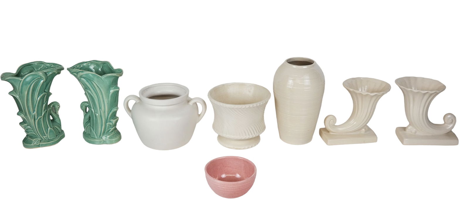 McCoy Collection of Pottery Vessels, 8: McCoy collection of assorted pottery vessels, comprising a pair of cream colored cornucopia [7" H x 8" L x 5" D], a pair of green glazed swan vases [9.25" H x 7" W x 4.25" D], a two handled jug [6.5"
