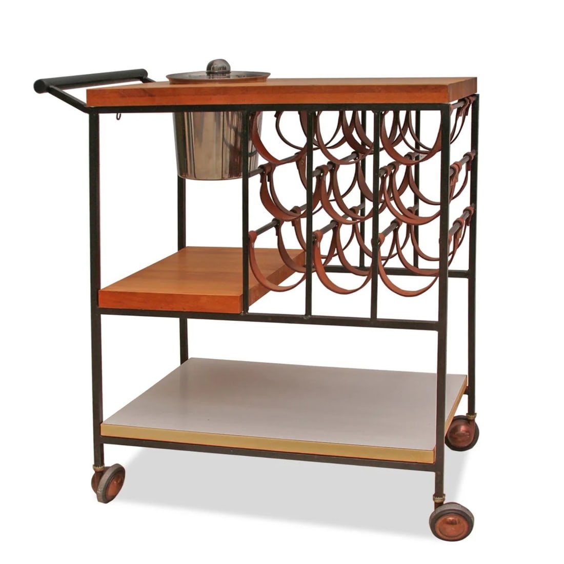 After Arthur Umanoff Mid-Century Modern Bar Cart: After Arthur Umanoff mid-century modern leather, wood, metal, and Formica bar cart, with chrome and plastic champagne bucket. [30.25" H x 28" W x 16" D]. Overall condition is good, the bronze-colored