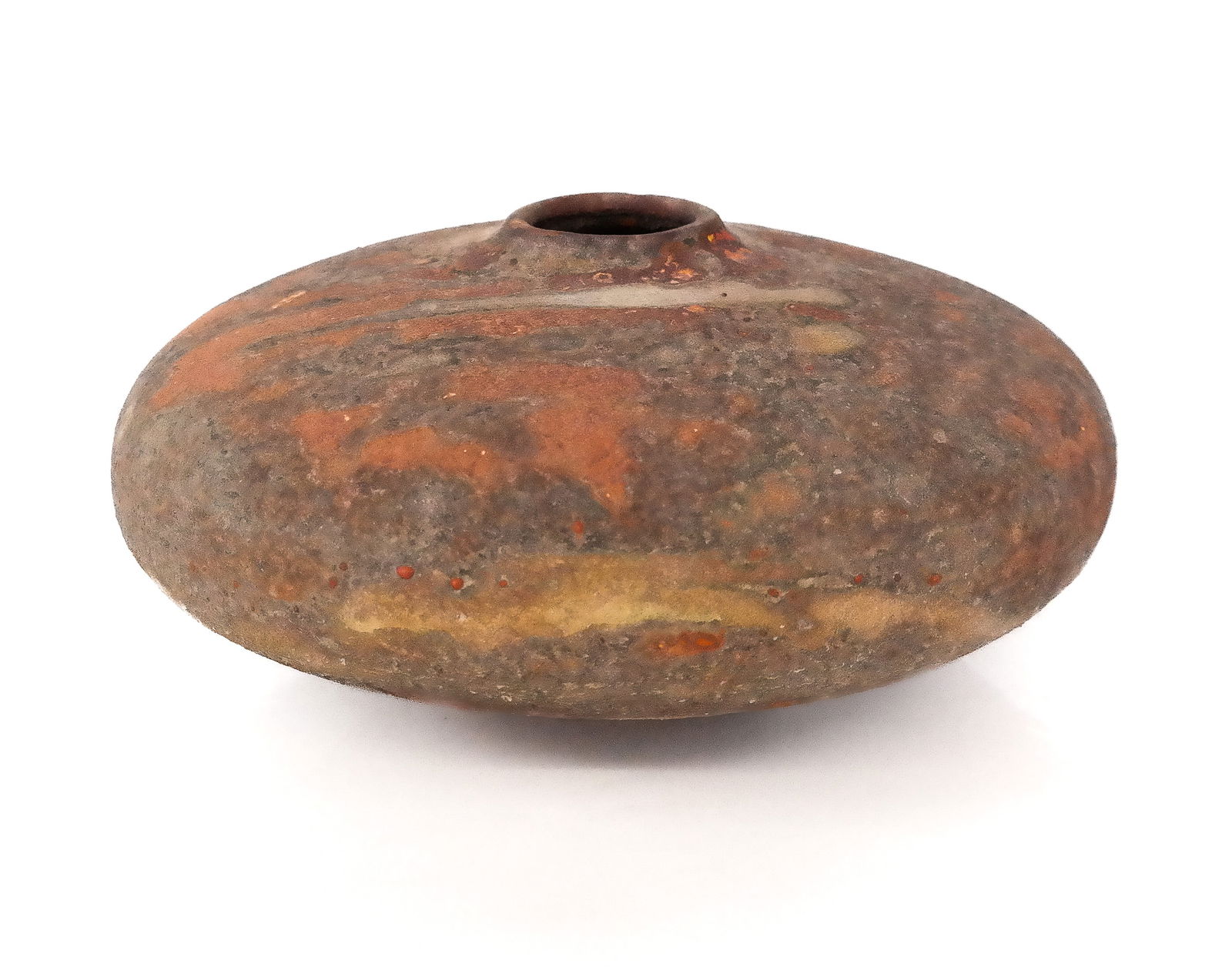 Peter Anderssen Art Pottery Vase: Peter Andersson art pottery vase, Australian, in dessert shade with accents of yellow and orange, mark to base. [6" H x 13" Diameter]. Overall condition is good.