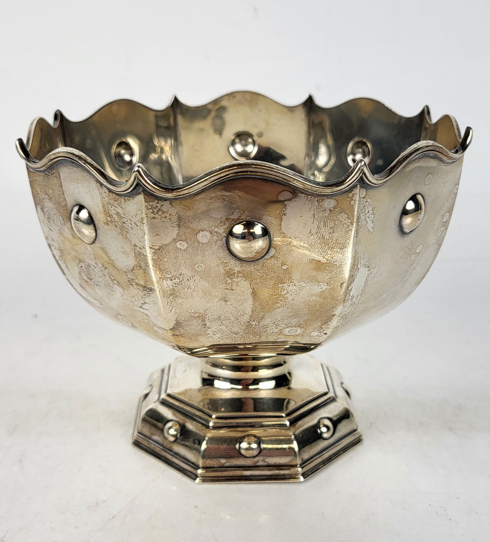 George V Silver Monteith: English silver monteith, Sheffield, 1922, by James Dixon & Sons, marks to side. [7 ozt., 5" H x 6" Diameter]. Overall condition is good.