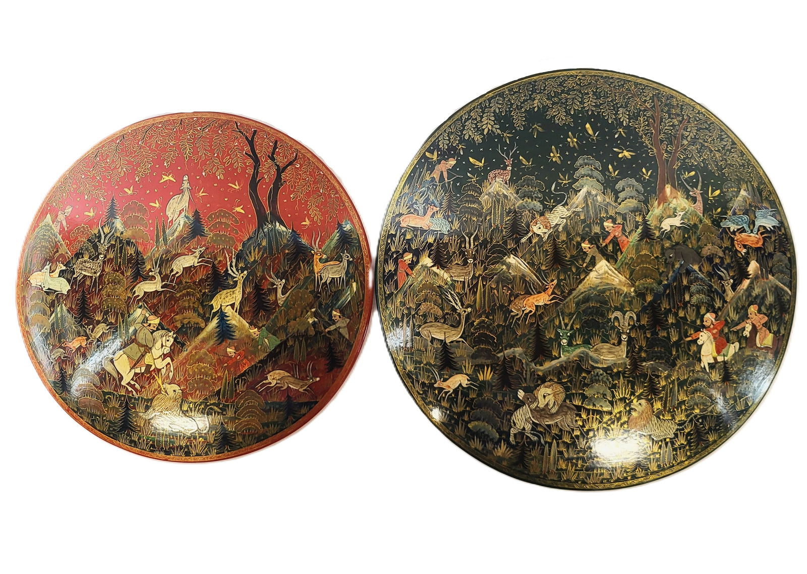 Two Kashmiri Paper Mache Rondels: Two paper mache rondels, Kashmir, 20th century, each with a hand painted and gilt decorated hunting scene, marked to reverse. [Larger: 11.75" Diameter]. Condition is good with some minor wear.