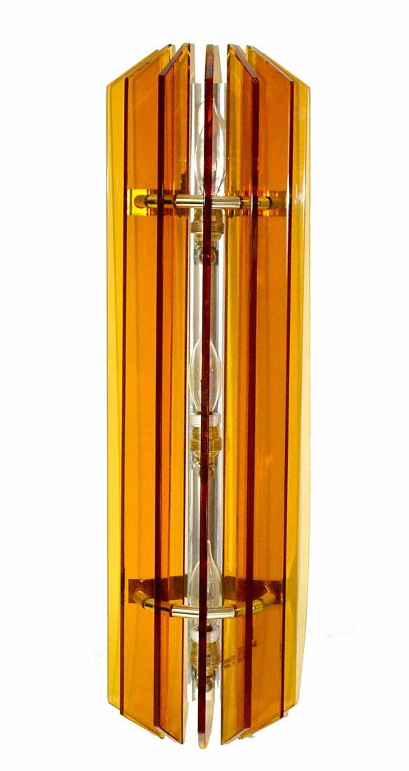 Modern Italian Chrome and Glass Sconce: Features 7 narrow amber glass "fins" arranged on an arched frame concealing three candelabra base sockets. Manufactured by Veca. [6"W x 4 1/4"D x 22"H]